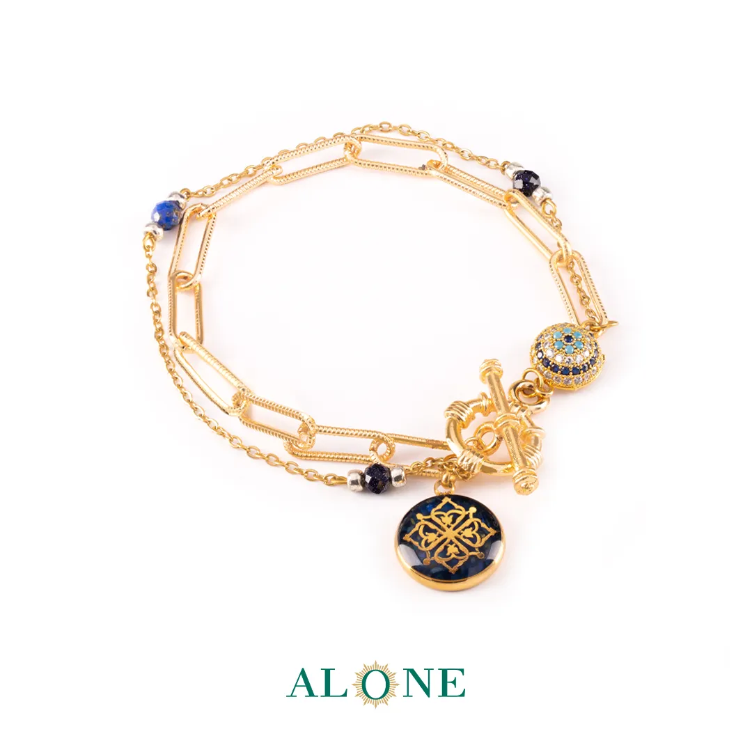 دستبند دلربا سرمه ای و زنجیر بیضی با آویز چشم ببر سرمه ای ترنم